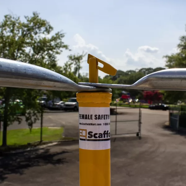 Scaffolding safety rail top connections using a spacelock.