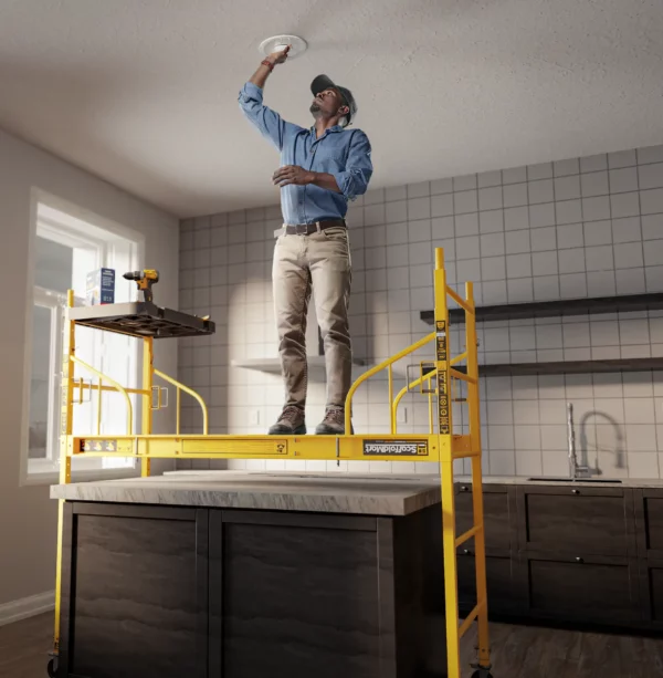 ScaffoldMart Multifunction Scaffold being used over a kitchen island to install recessed lights.